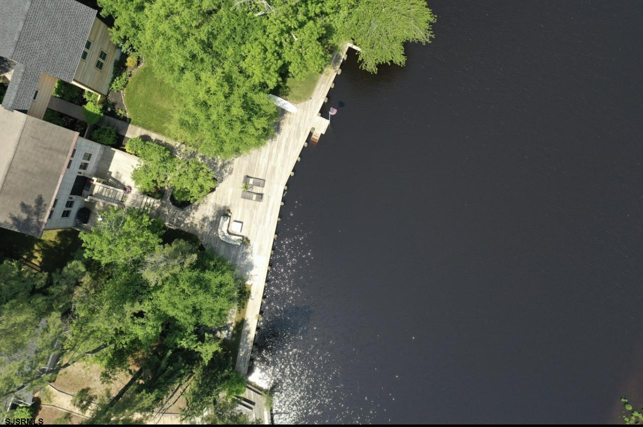 4646 Riverside Drive Sweetwater, NJ 08037 - Photo 5 of 55 an aerial view of a house with a yard and garden in the back