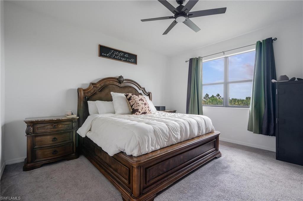 5519 Useppa Drive Ave Maria, FL 34142 - Photo 13 of 32 a bedroom with a bed and window
