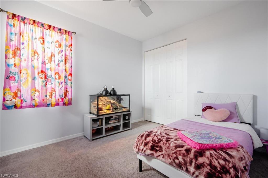 5519 Useppa Drive Ave Maria, FL 34142 - Photo 19 of 32 a bedroom with a bed and a window