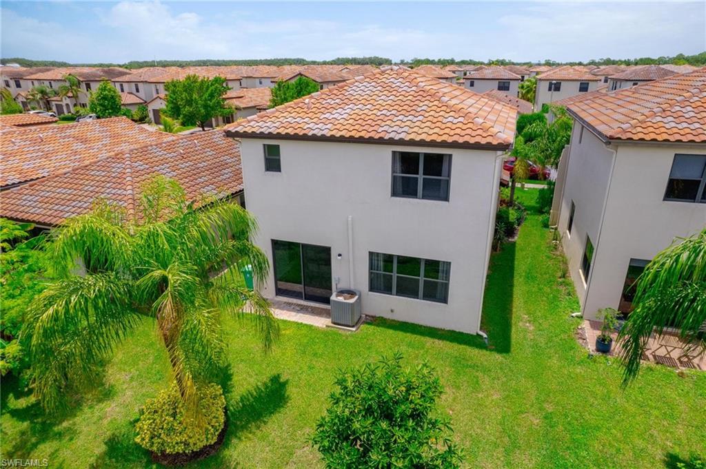 5519 Useppa Drive Ave Maria, FL 34142 - Photo 26 of 32 a aerial view of a house with porch and garden