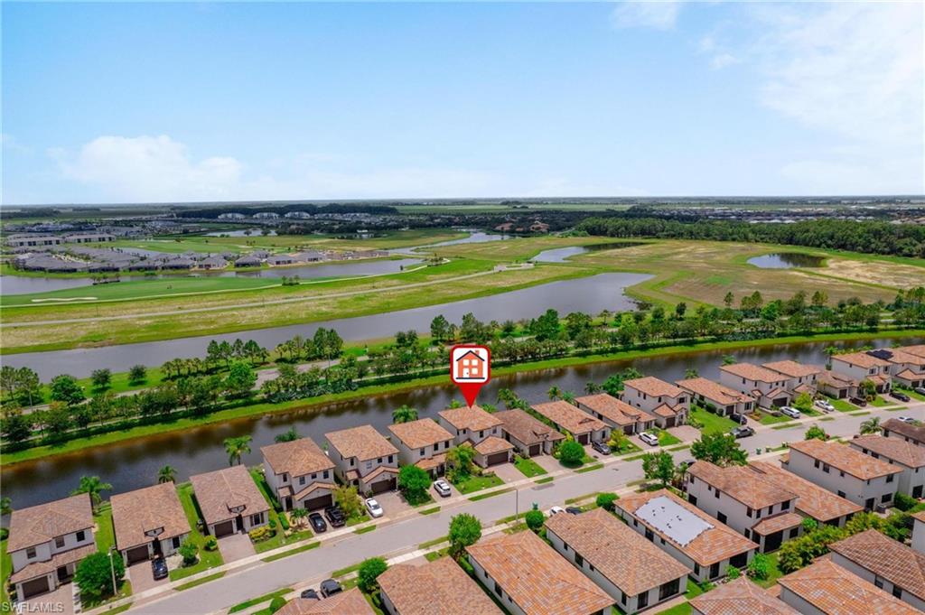 5519 Useppa Drive Ave Maria, FL 34142 - Photo 27 of 32 an aerial view of a city and lake view