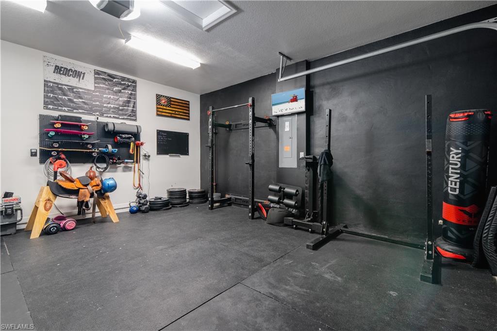 5519 Useppa Drive Ave Maria, FL 34142 - Photo 29 of 32 a view of a room with gym equipment