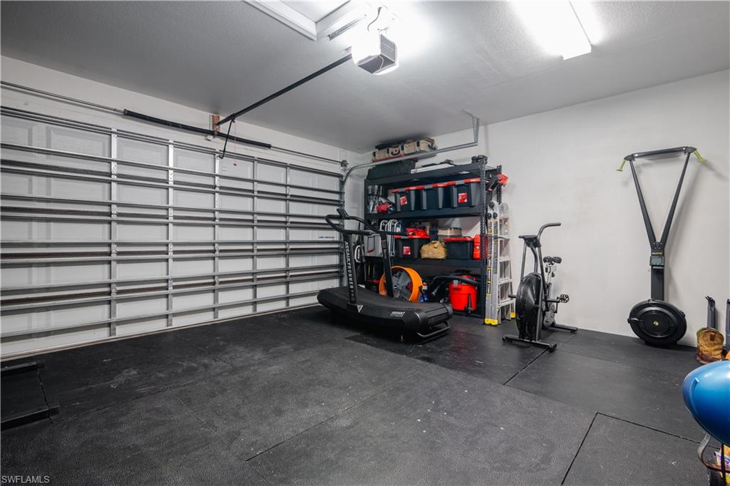 5519 Useppa Drive Ave Maria, FL 34142 - Photo 30 of 32 a view of a garage with rack and bicycle