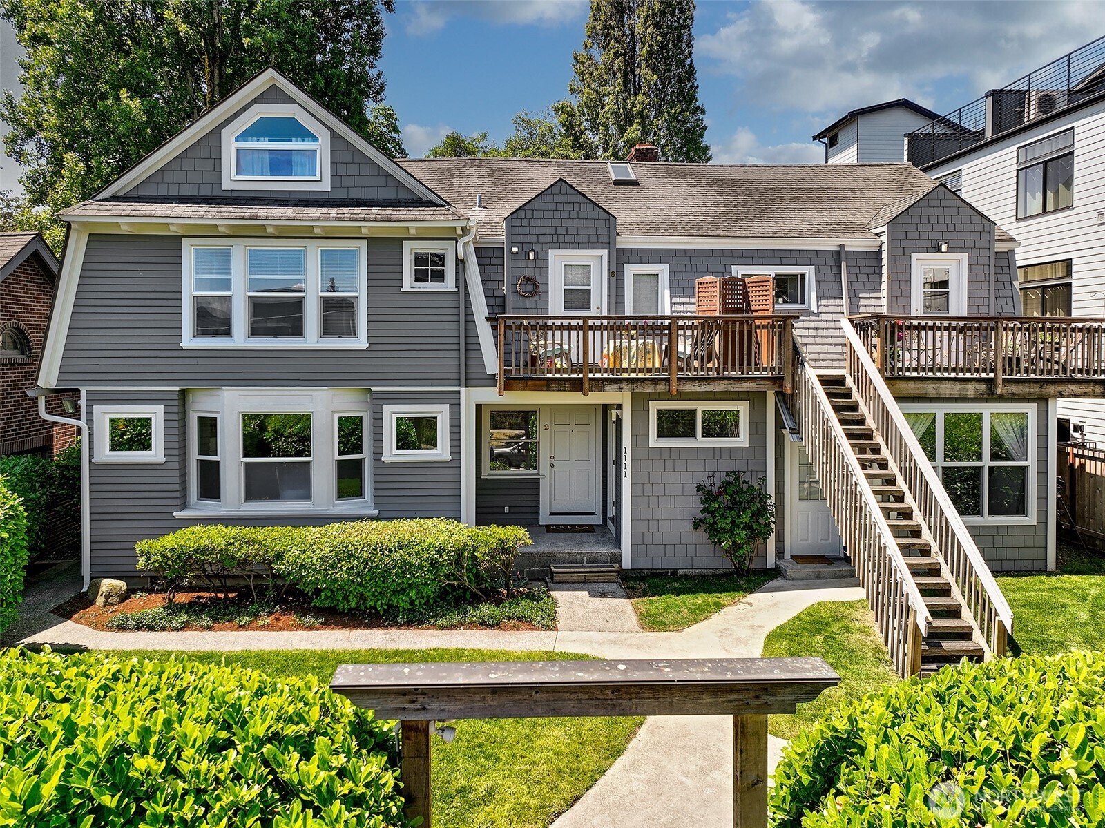 1111 18th Avenue Seattle, WA 98122 - Photo 2 of 40 a front view of a house with garden