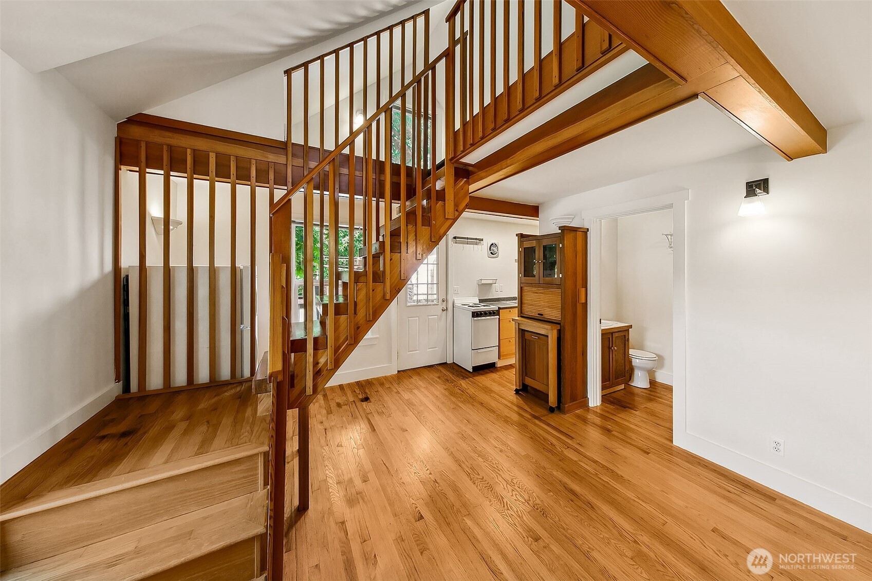 1111 18th Avenue Seattle, WA 98122 - Photo 25 of 40 a view of entryway with wooden floor and stairs