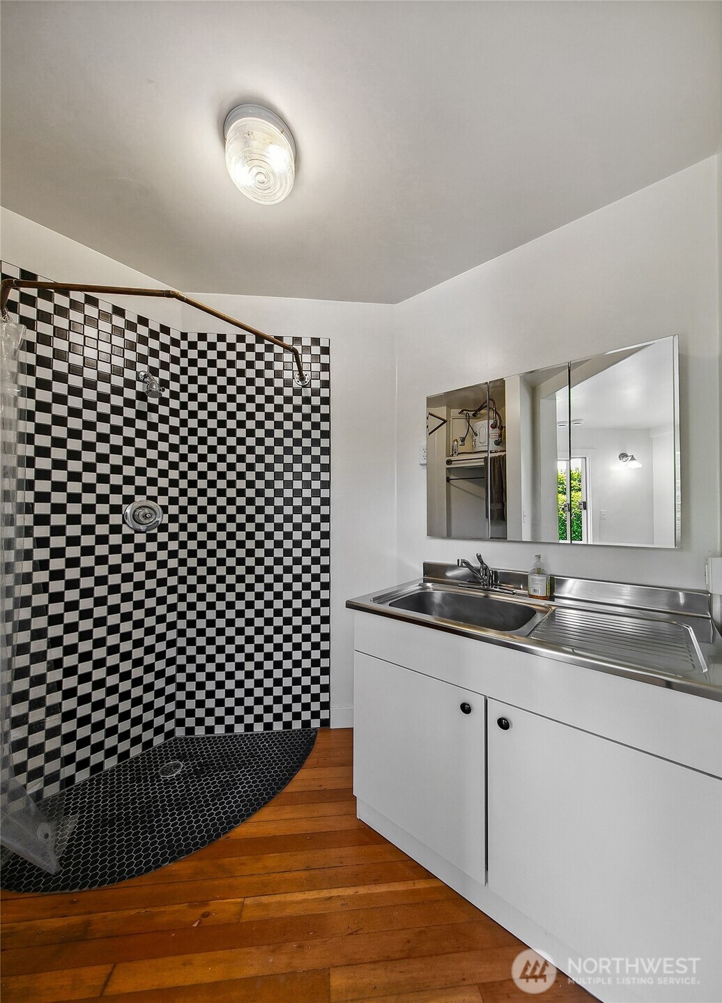 1111 18th Avenue Seattle, WA 98122 - Photo 34 of 40 a kitchen with a sink and cabinets