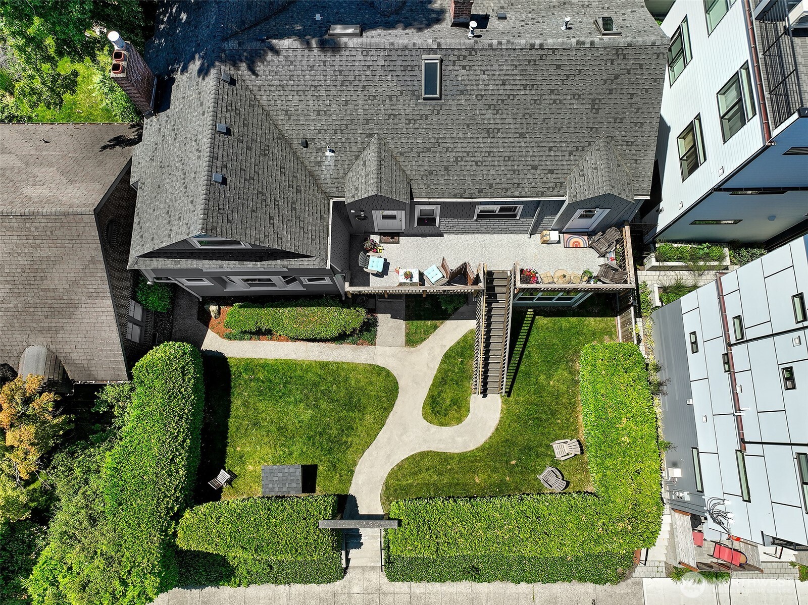 1111 18th Avenue Seattle, WA 98122 - Photo 6 of 40 an aerial view of a swimming pool with outdoor seating and yard