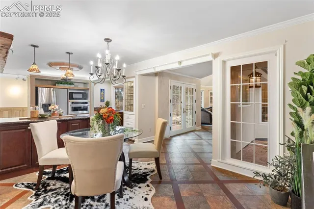 a very nice looking dining room with a table and chairs
