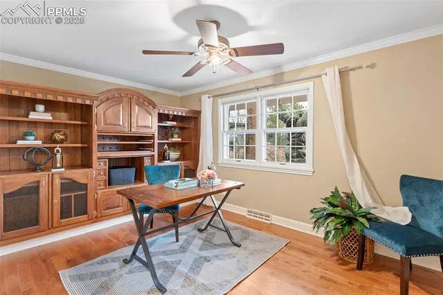 a workspace with furniture window and wooden floor