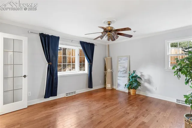 a view of a livingroom with furniture window and wooden floor