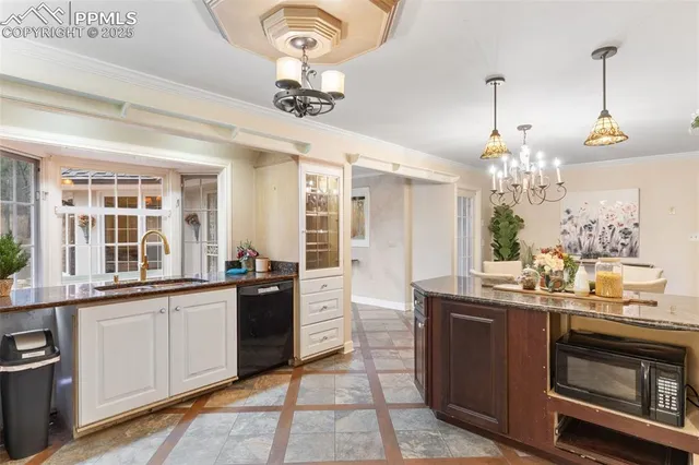 a kitchen with a sink and stove