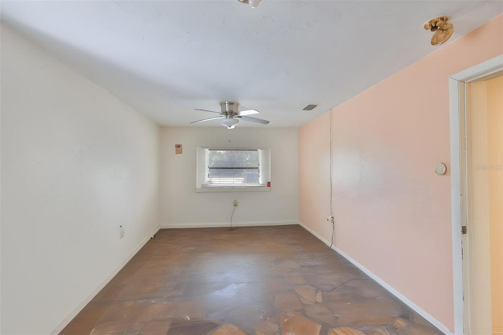 14451 Highland Road Wimauma, FL 33598 - Photo 65 of 80 wooden floor in an empty room