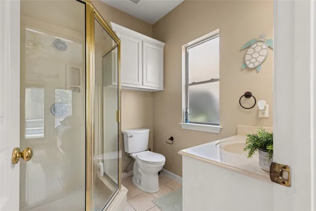 a bathroom with a toilet a sink and tub