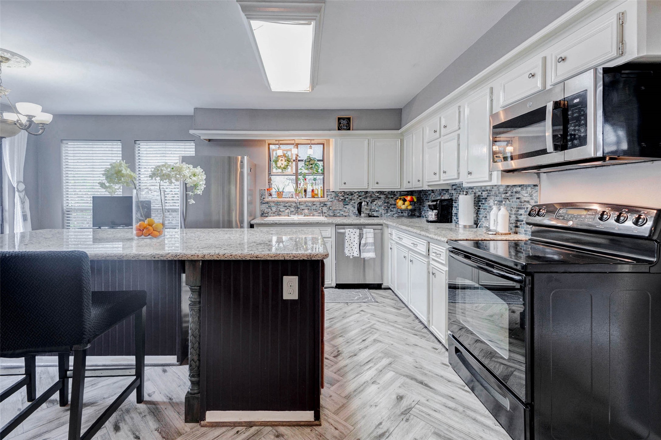 202 Old Bridge Lake Street Houston, TX 77069 - Photo 6 of 27 a kitchen with a sink stainless steel appliances and cabinets
