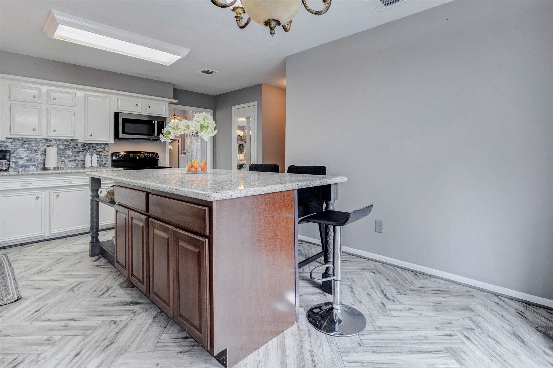 202 Old Bridge Lake Street Houston, TX 77069 - Photo 8 of 27 a kitchen with kitchen island a sink appliances and cabinets