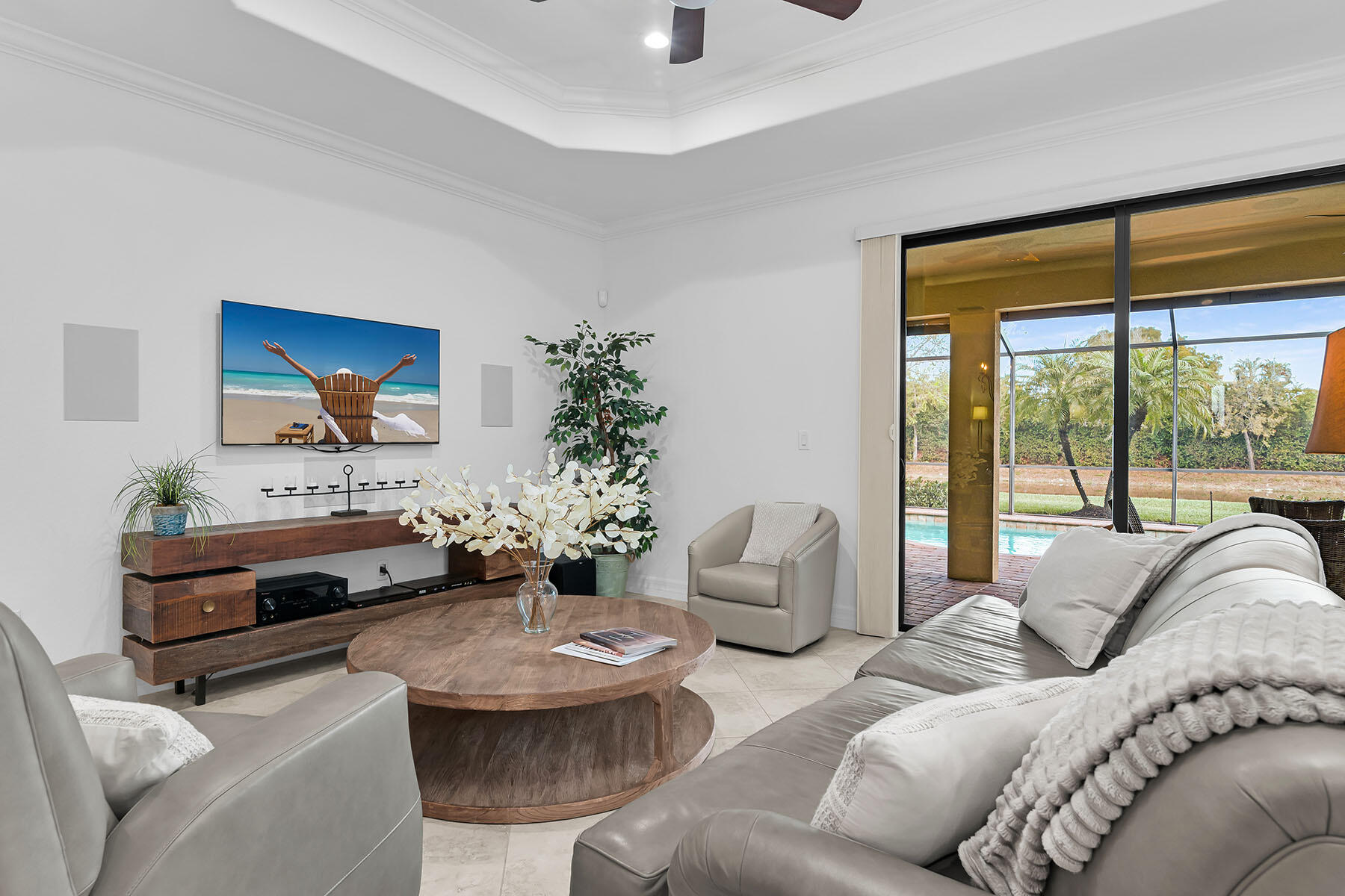 2990 Aviamar Circle Naples, FL 34114 - Photo 12 of 44 a living room with furniture and a large window
