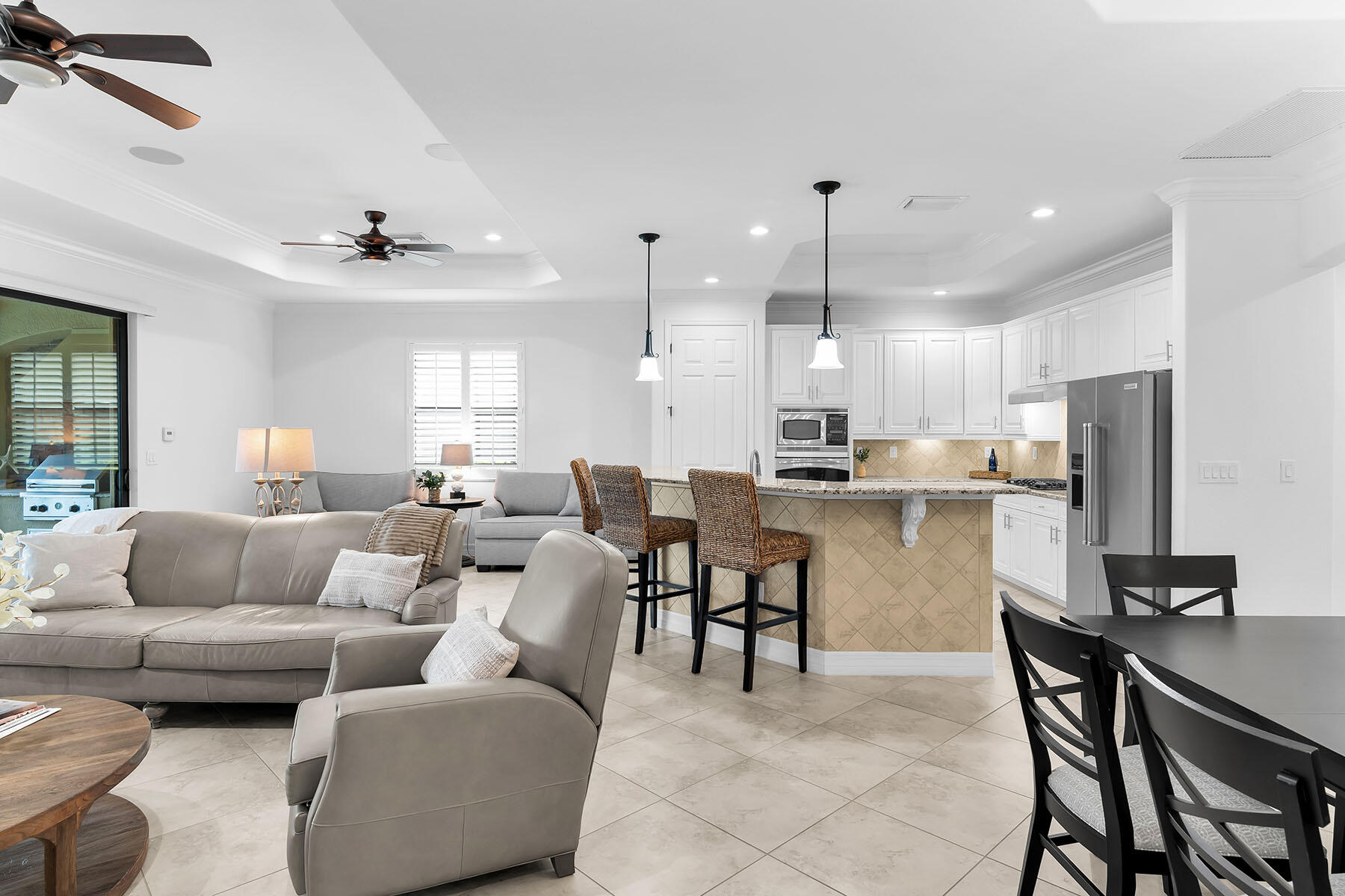 2990 Aviamar Circle Naples, FL 34114 - Photo 14 of 44 a living room with furniture kitchen and a dining table