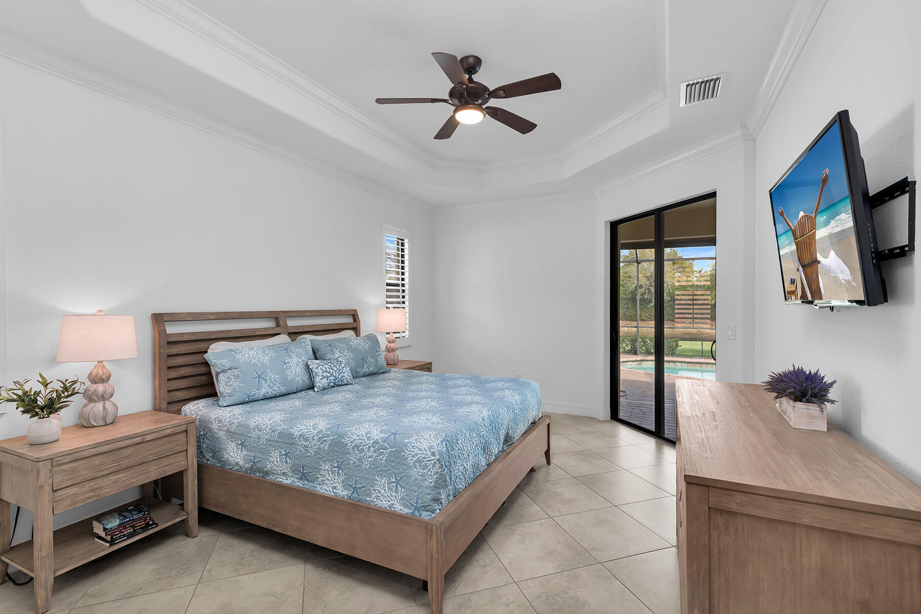 2990 Aviamar Circle Naples, FL 34114 - Photo 15 of 44 a bedroom with a bed a window and a potted plant