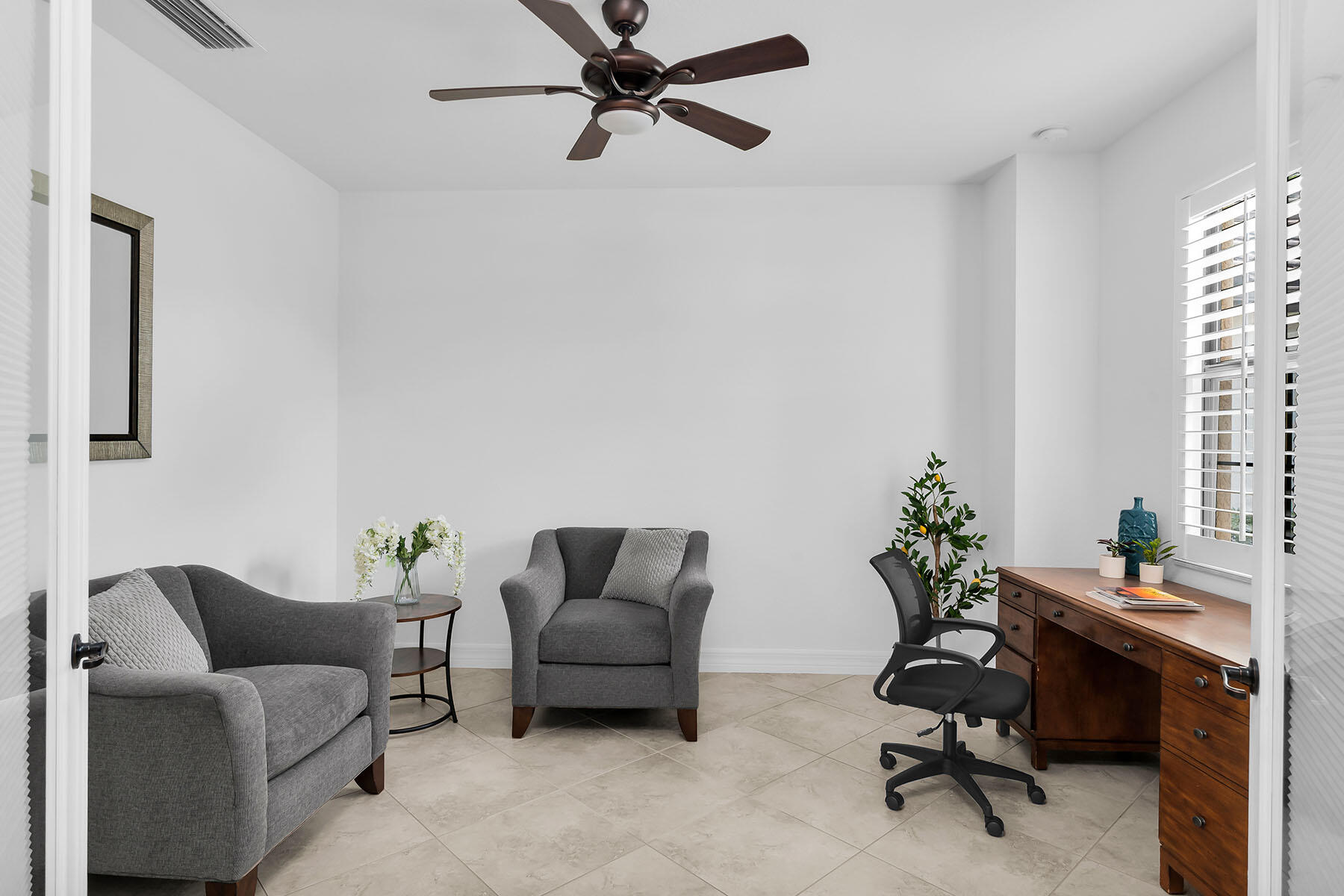 2990 Aviamar Circle Naples, FL 34114 - Photo 20 of 44 a work room with furniture and a potted plant