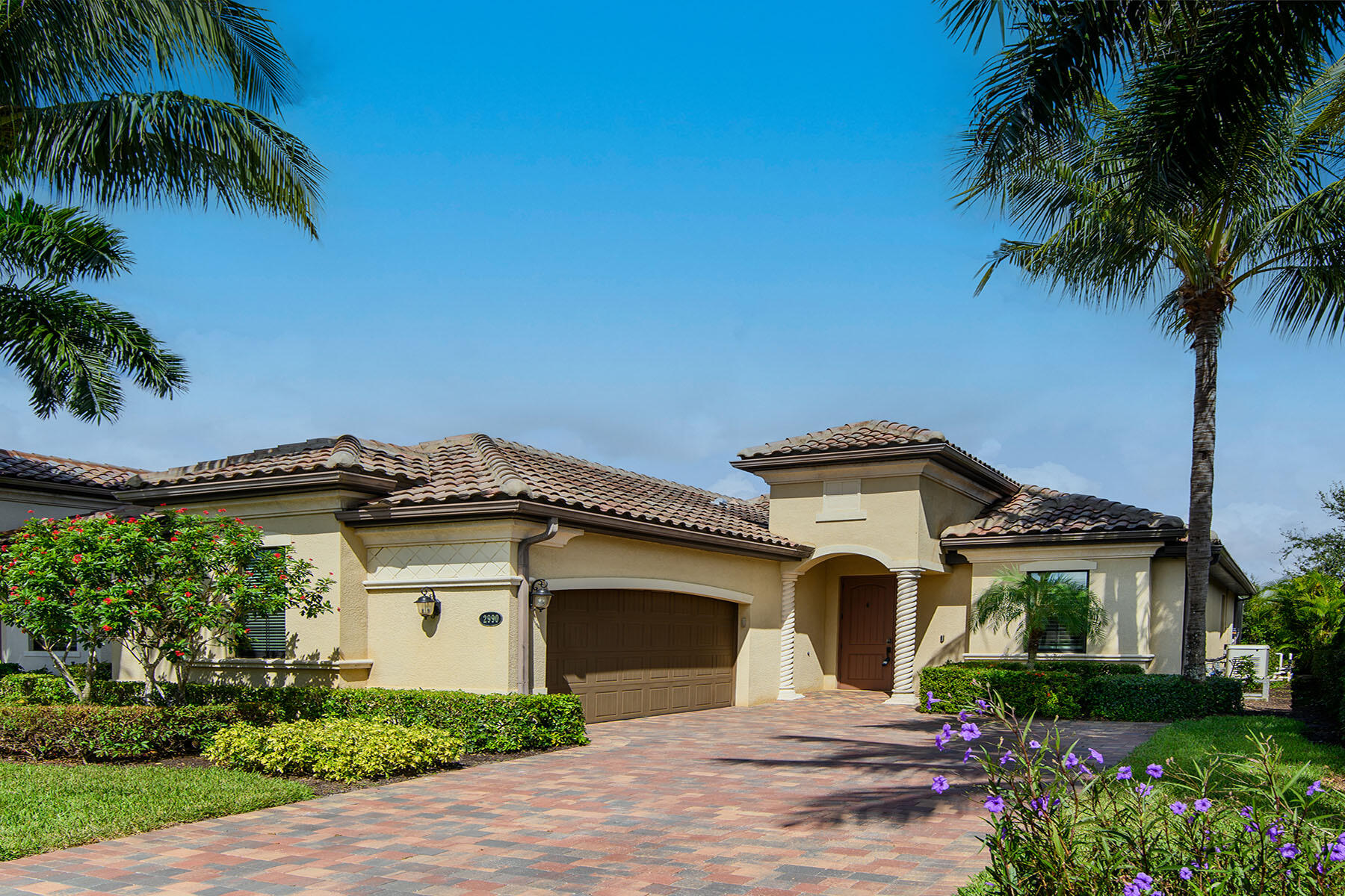 2990 Aviamar Circle Naples, FL 34114 - Photo 3 of 44 a front view of a house with a garden