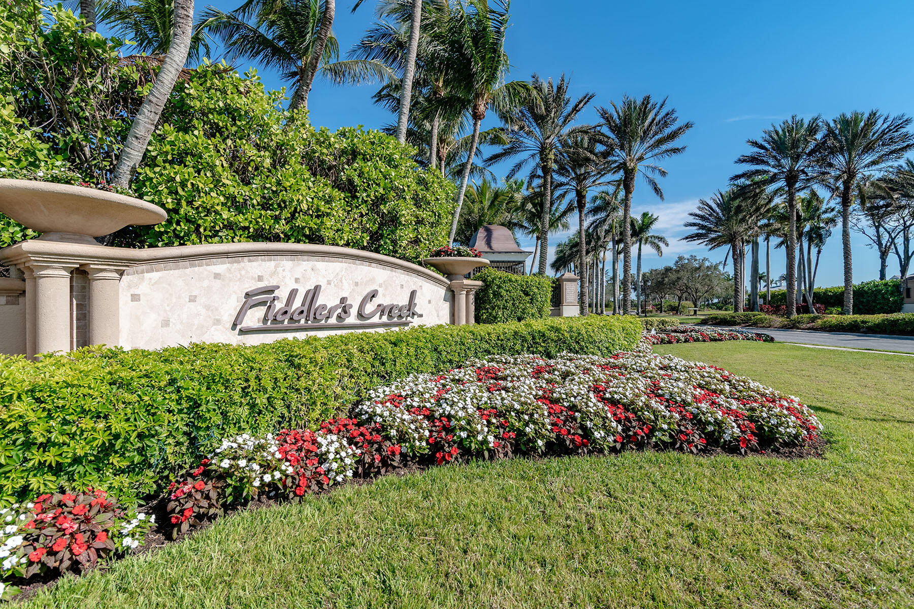 2990 Aviamar Circle Naples, FL 34114 - Photo 36 of 44 a view of a garden with flowers and trees