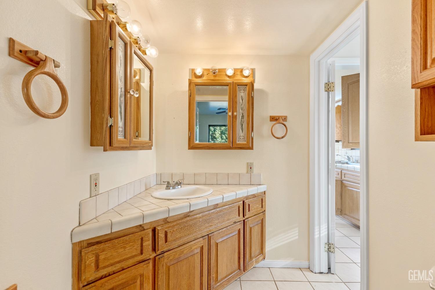 Undisclosed Address Tehachapi, CA 93561 - Photo 15 of 37 a bathroom with a sink and a mirror