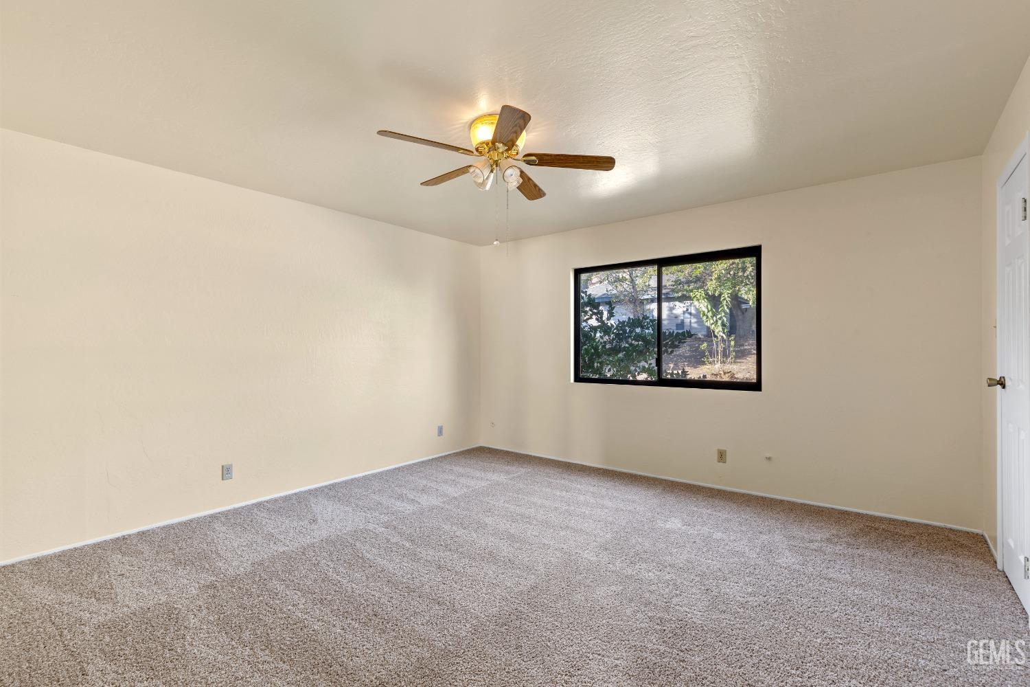 Undisclosed Address Tehachapi, CA 93561 - Photo 16 of 37 an empty room with windows and ceiling fan