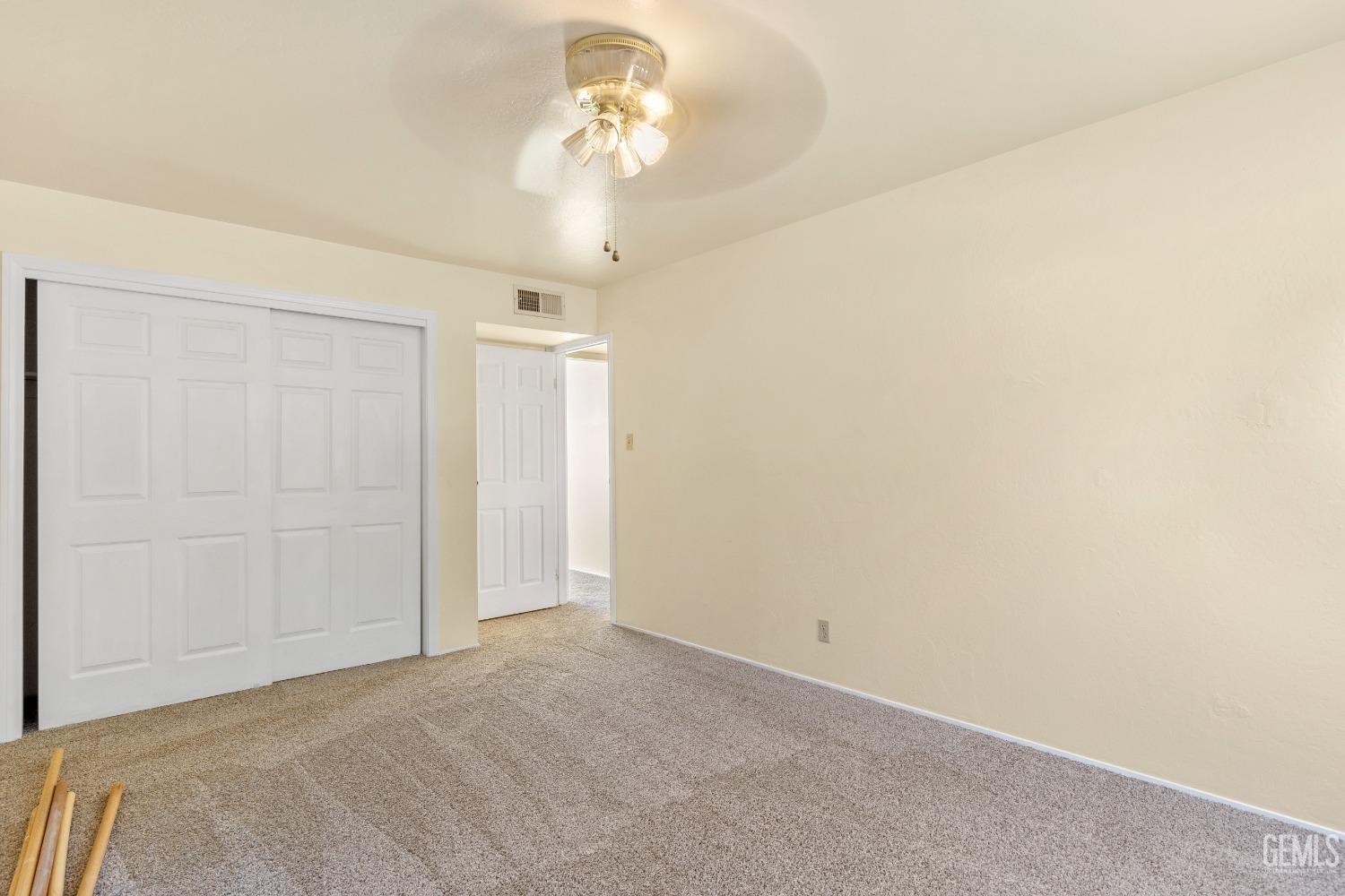 Undisclosed Address Tehachapi, CA 93561 - Photo 20 of 37 a view of a chandelier fan and closet in a room
