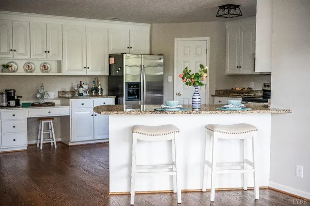 a bath tub sitting in a bathroom next to a window