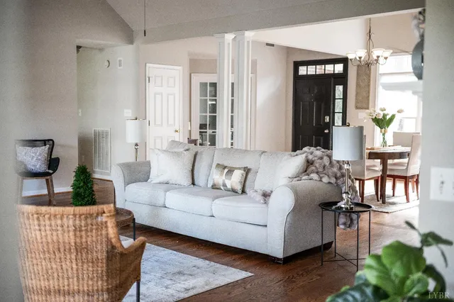 a big room with wooden floor and natural light