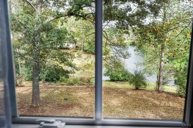 a spacious bedroom with a bed and a window