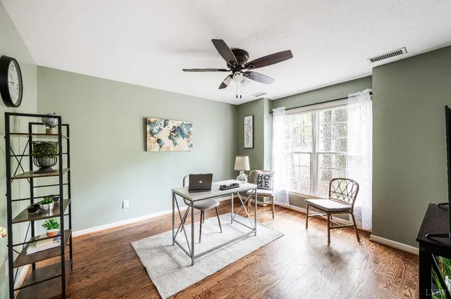 a view of balcony with wooden floor and outdoor seating