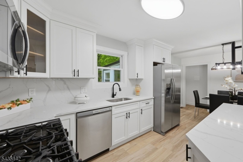 36 Ruth Street Hopatcong, NJ 07874 - Photo 6 of 25 a kitchen with a sink cabinets and appliances