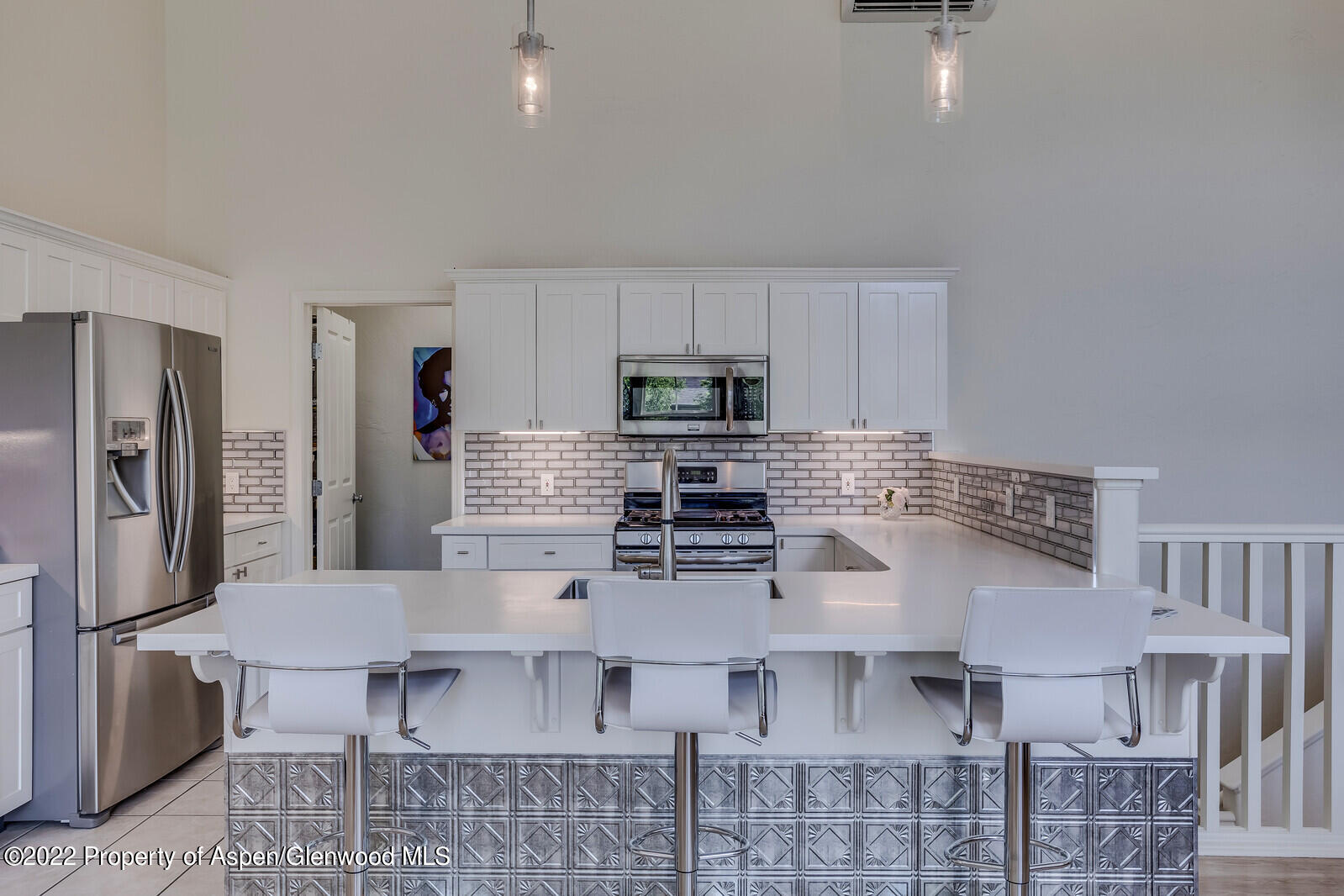 620 Evans Court Basalt, CO 81621 - Photo 1 of 35 a kitchen with stainless steel appliances kitchen island granite countertop a refrigerator and microwave