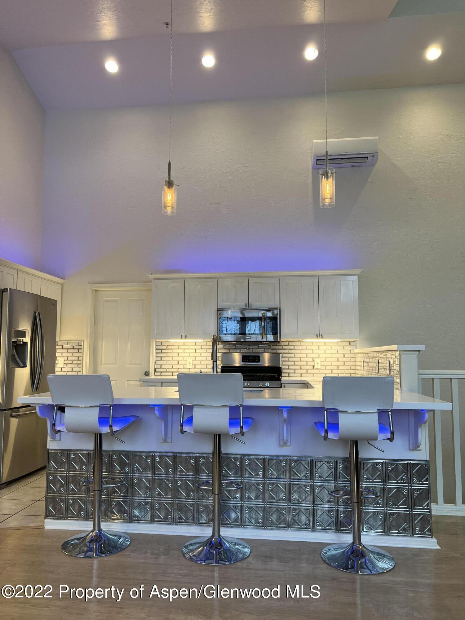 620 Evans Court Basalt, CO 81621 - Photo 15 of 35 a kitchen with stainless steel appliances granite countertop a sink stove and cabinets