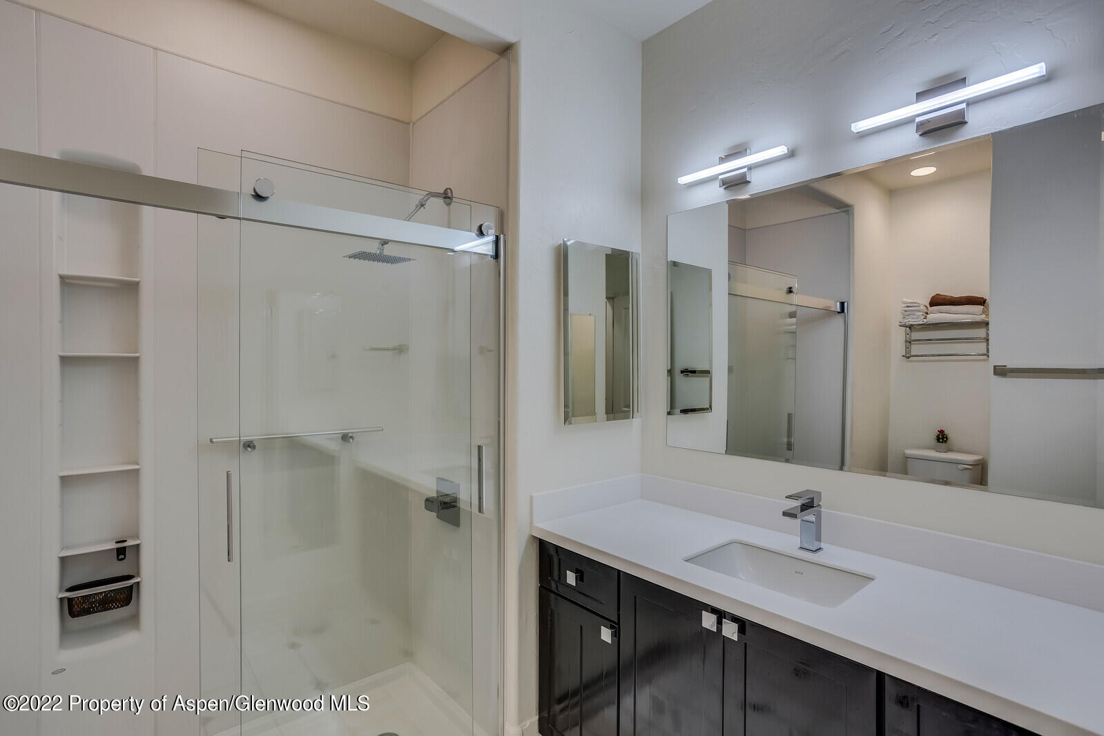 620 Evans Court Basalt, CO 81621 - Photo 24 of 35 a bathroom with a granite countertop sink shower and a mirror