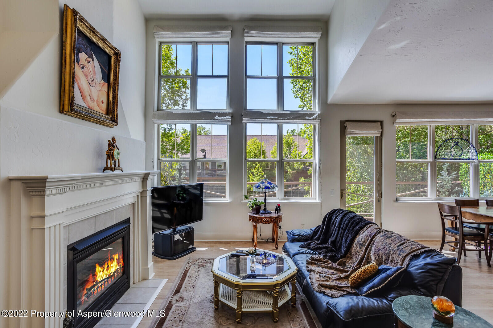 620 Evans Court Basalt, CO 81621 - Photo 7 of 35 a living room with furniture a fireplace and large windows