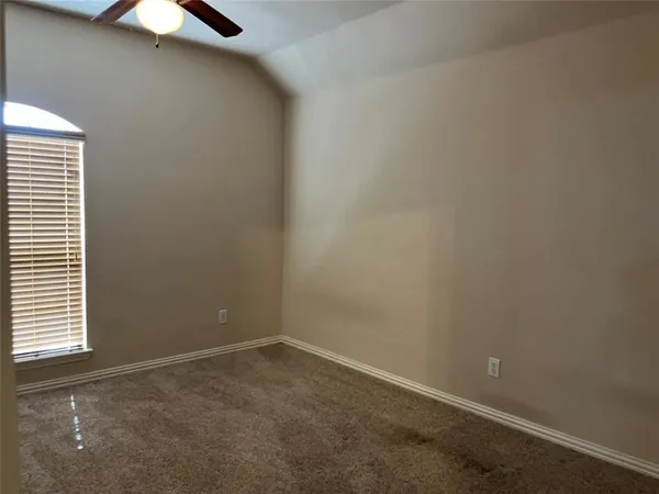 an empty room with closet area