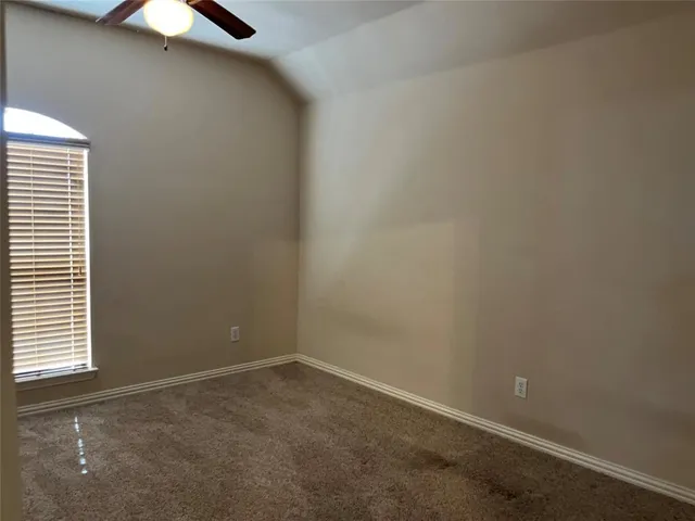 an empty room with closet area