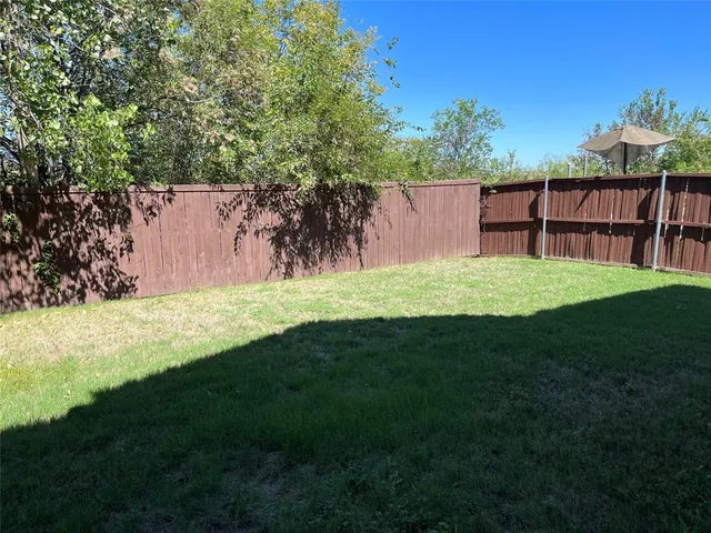 a view of a backyard with a garden