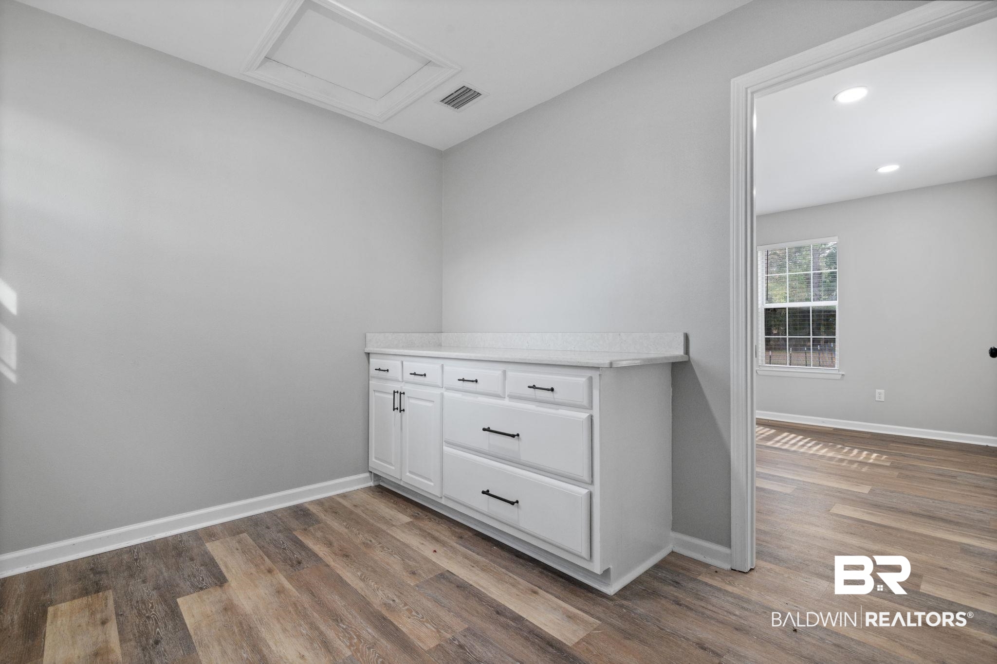 13461 Tom Gaston Road Mobile, AL 36695 - Photo 33 of 41 Spare room featuring attic access, light wood finished floors, and recessed lighting
