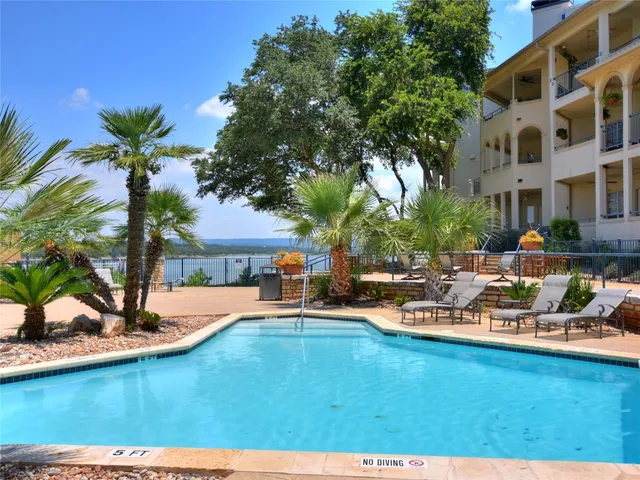 a swimming pool with outdoor seating