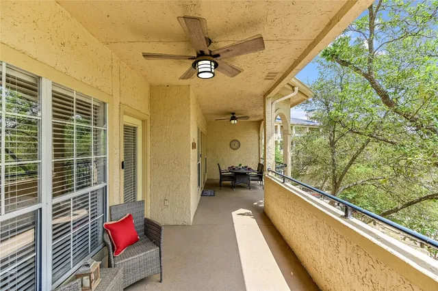 a view of a living room and a balcony