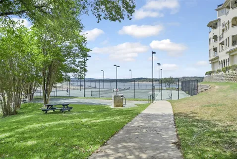 a view of a park with large trees