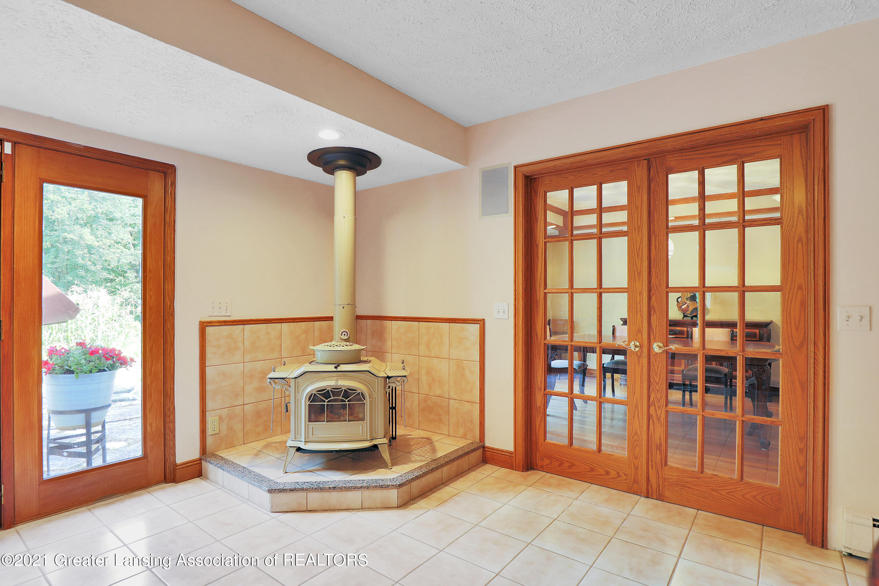 2274 College Road Holt, MI 48842 - Photo 9 of 38 Woodstove in kitchen