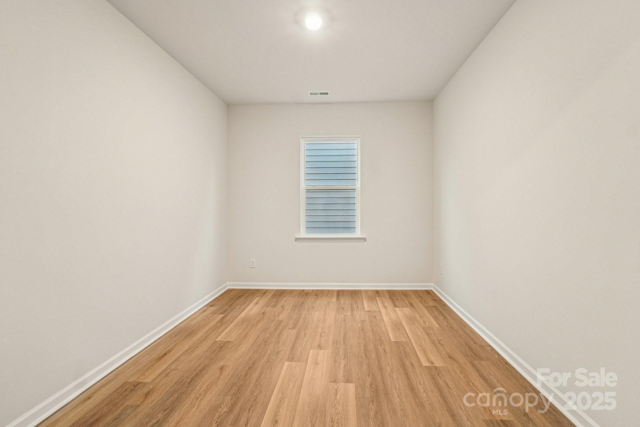 7636 Bainbridge Road Sherrills Ford, NC 28673 - Photo 13 of 31 a view of a room with wooden floor and windows