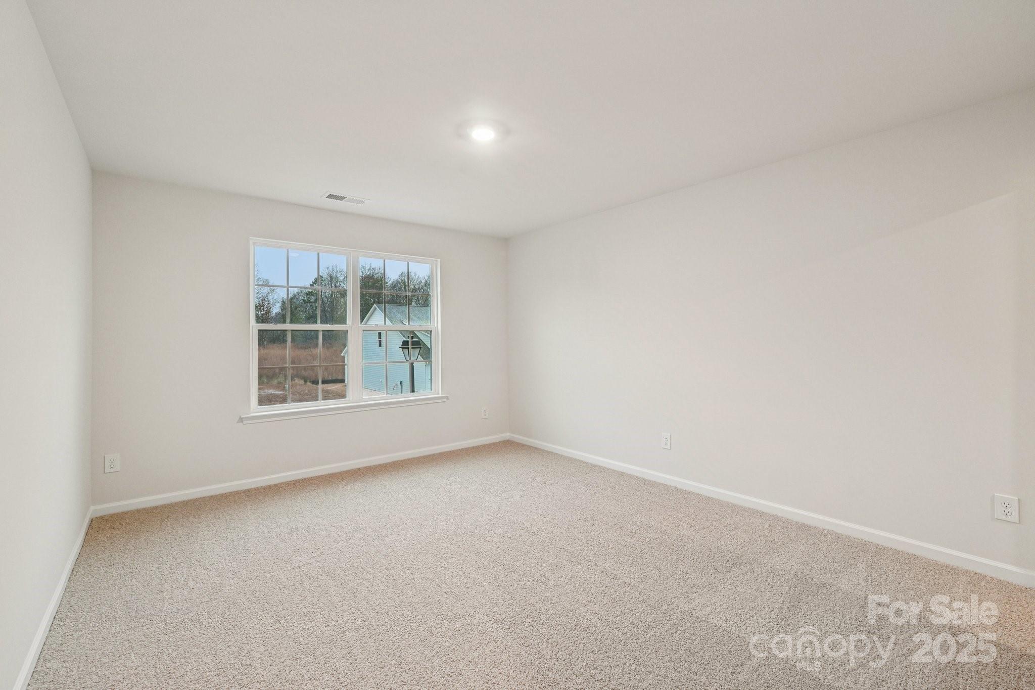 7636 Bainbridge Road Sherrills Ford, NC 28673 - Photo 20 of 31 an empty room with windows