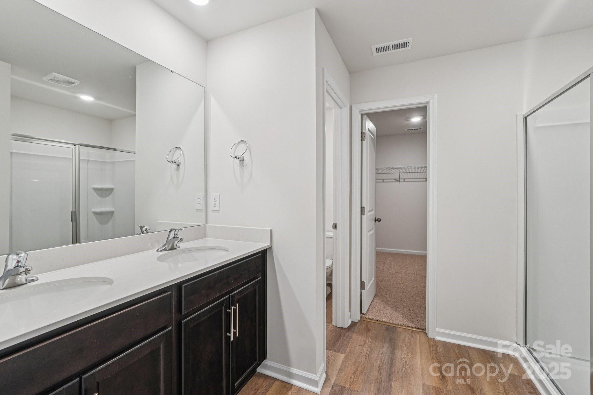 7636 Bainbridge Road Sherrills Ford, NC 28673 - Photo 30 of 31 a bathroom with a sink a mirror and a shower