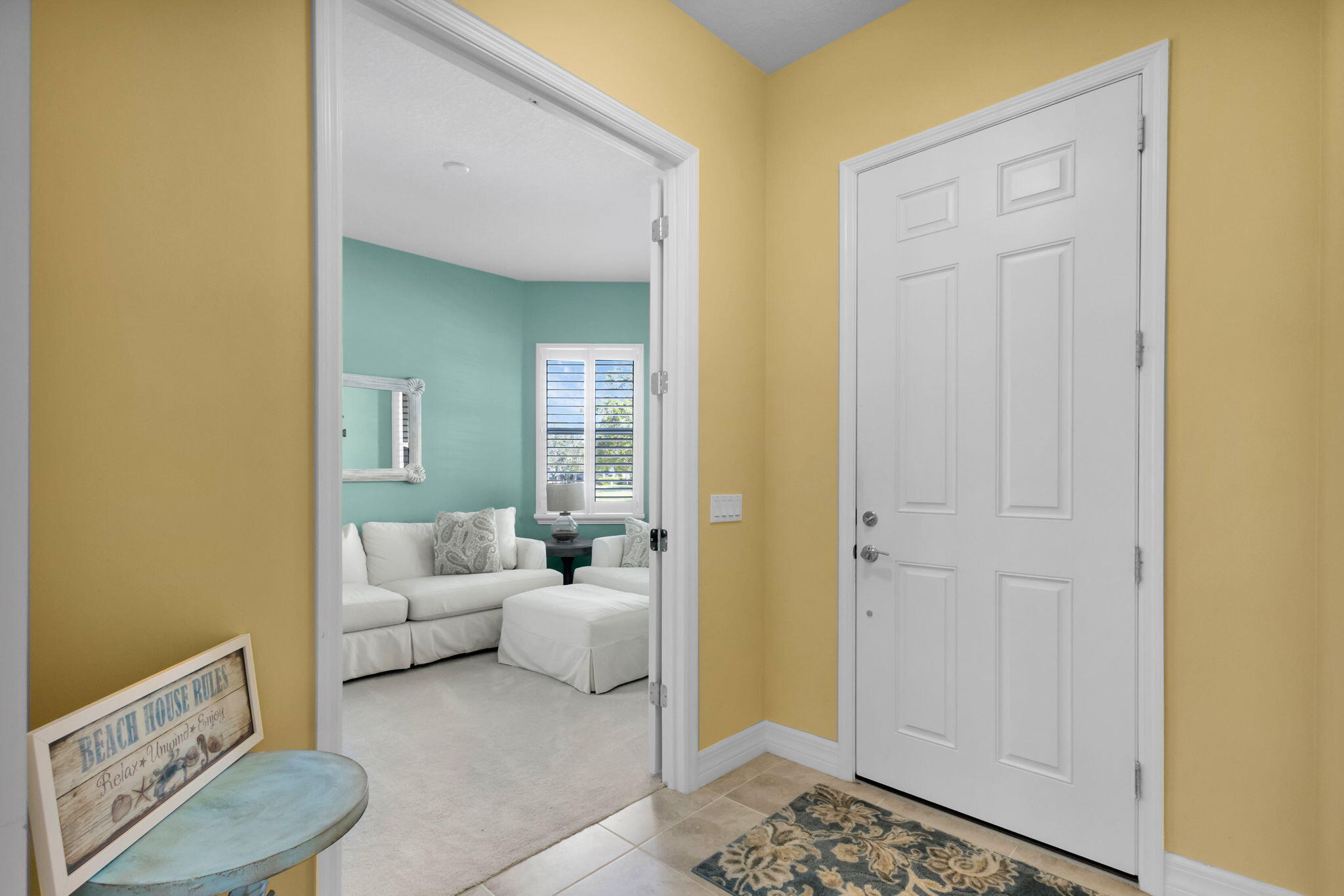 1122 South Prescott Drive Jupiter, FL 33458 - Photo 13 of 43 a living room with furniture and a gate