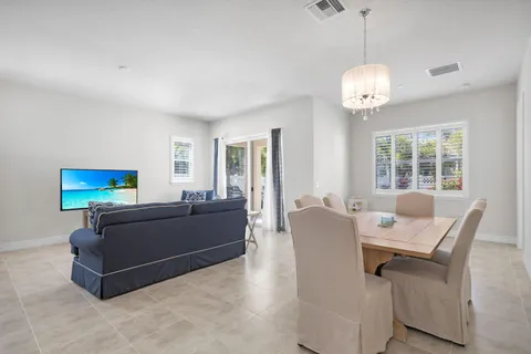 a living room with furniture window and flat screen tv